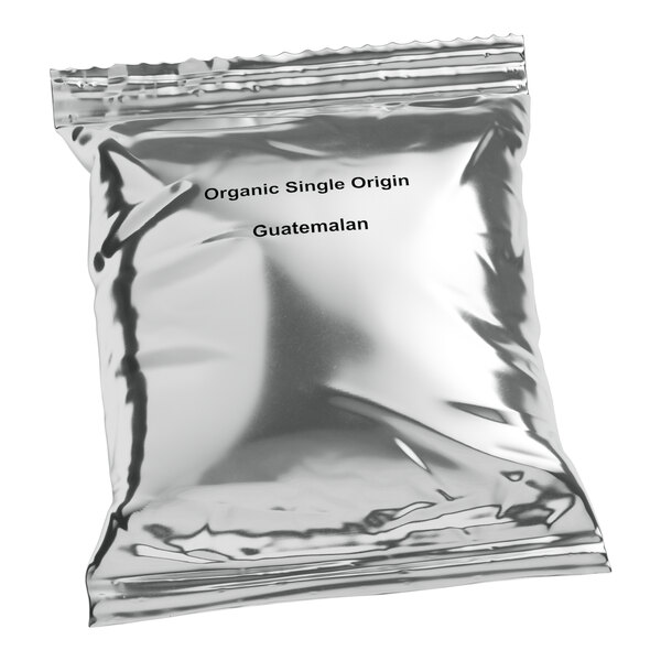 A silver Crown Beverages bag of organic single origin Guatemalan coffee. The text is black.