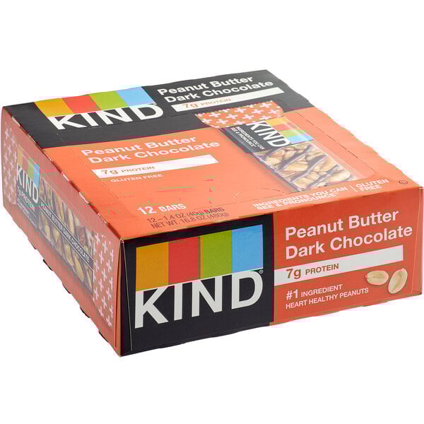 A box of 12 KIND Peanut Butter Dark Chocolate bars on a counter.