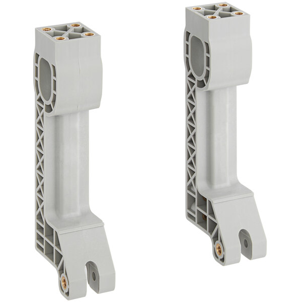 A pair of white plastic brackets with two holes.