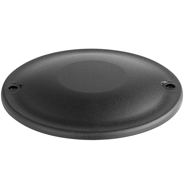 A black round plastic cover with holes.