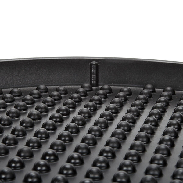 A black polypropylene pizza tray with a textured surface.