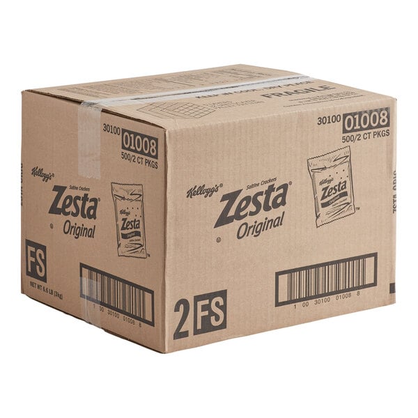 A large cardboard shipping box labeled 'Kellogg's Zesta Original Saltine Crackers' with various barcodes and product information printed on the sides.