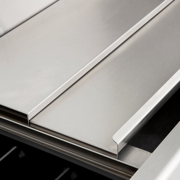 A stainless steel Eagle Group underbar ice bin with a metal surface.