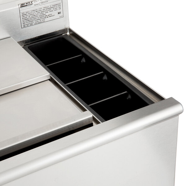 An Eagle Group stainless steel underbar ice bin with a cold plate and metal tray.