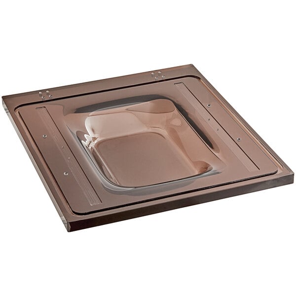 A brown square lid with a clear surface on top of a VacPak-It vacuum packaging machine.