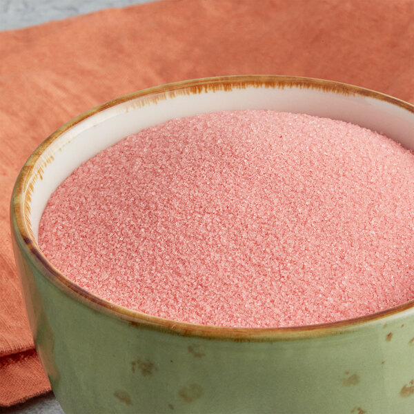 A bowl of Great Western Cherry Popcorn Glaze powder.