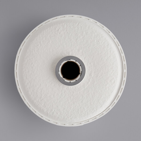 A white round object with a hole in the center.