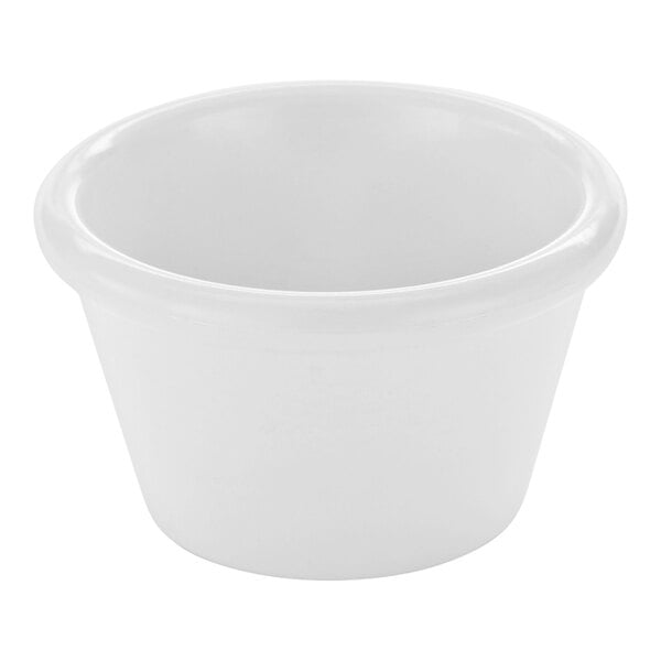 A small, smooth, white, round ramekin with a slightly flared rim.
