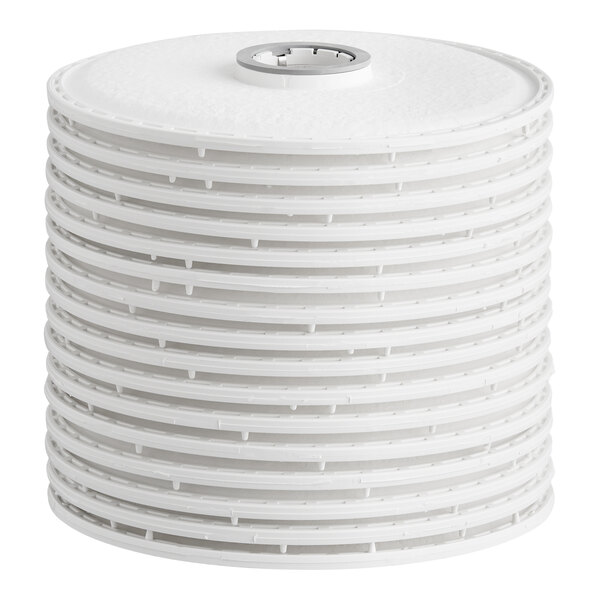A stack of 12-inch white filter cartridges with a central opening, designed for filtration systems.