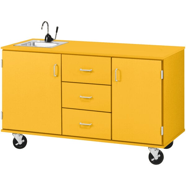 A sun yellow Demonstration Station with sink, drawers, and storage cabinets on wheels.