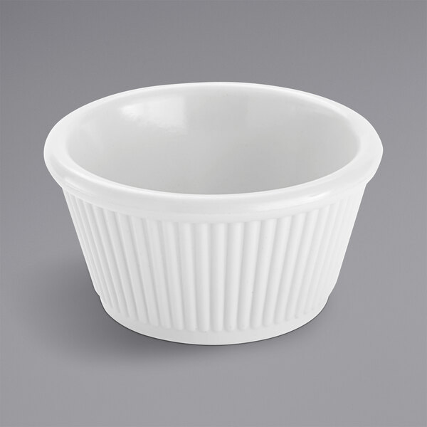 An American Metalcraft white melamine ramekin with a fluted rim.