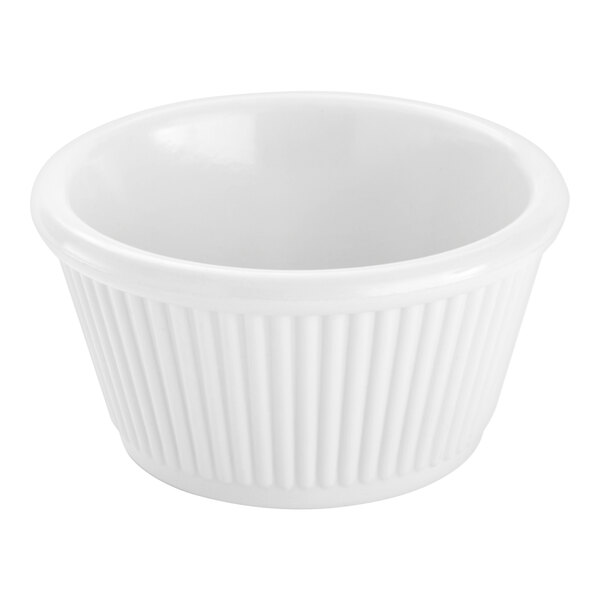 A small, white, fluted ramekin with a smooth interior and ribbed exterior.