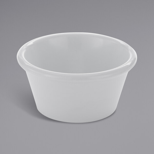 An American Metalcraft white melamine ramekin on a gray surface.