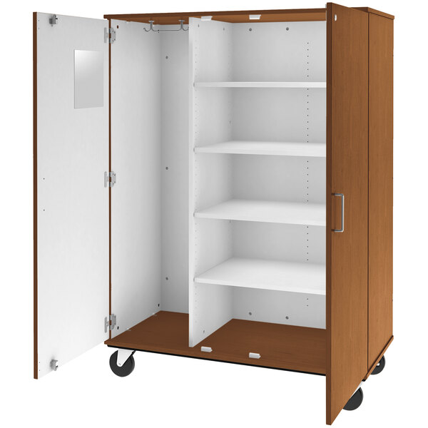 A medium cherry wooden cabinet with white doors and shelves.