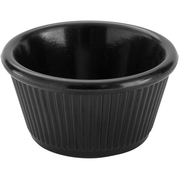 A black fluted melamine ramekin.