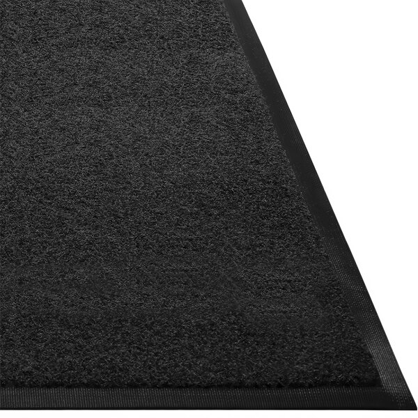 A white background with a close-up of a black Guardian Prestige carpet with a black border.