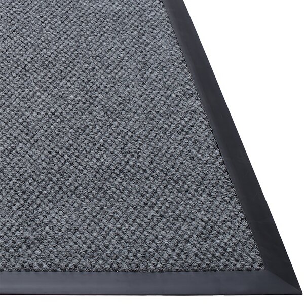 A customizable berber carpet entrance mat with a black and gray center and black border with rubber backing.