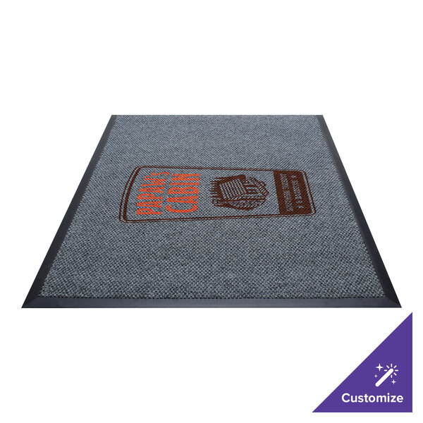A grey Guardian EliteGuard carpet entrance mat with a red and orange logo on it.