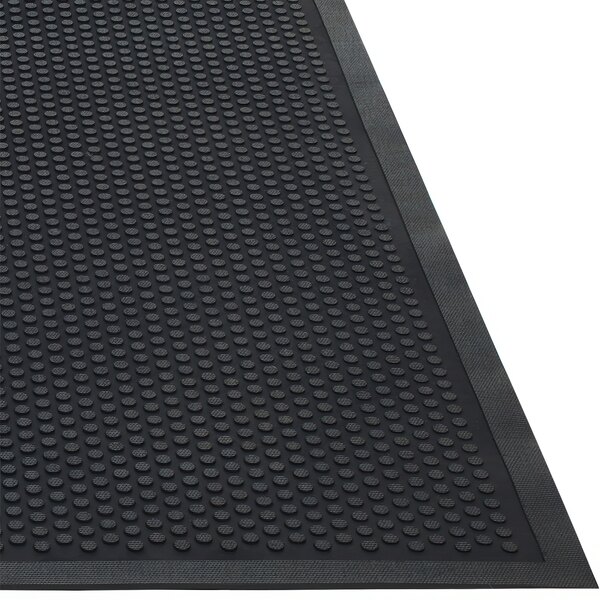A black rubber Guardian Clean Step entrance mat with dots and a black border.