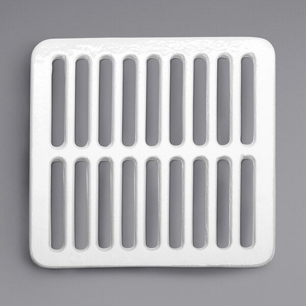 A white square Zurn enameled grate with holes.