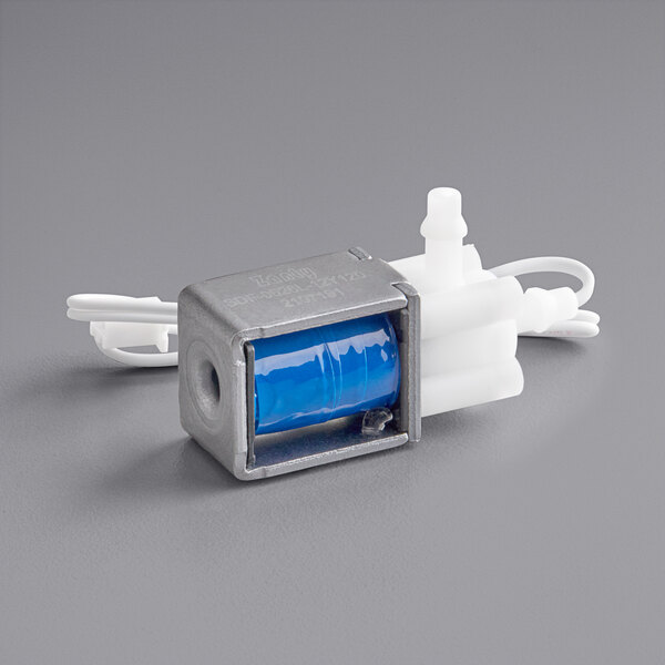 A small blue cylinder with white wires.