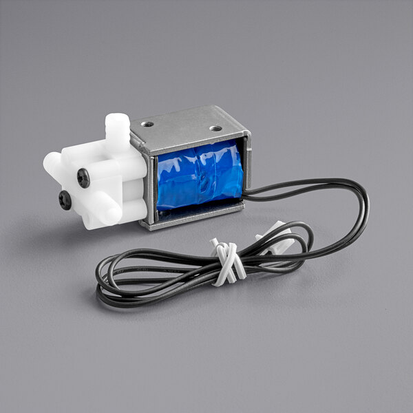 A small metal solenoid valve with a blue and white plastic cover.