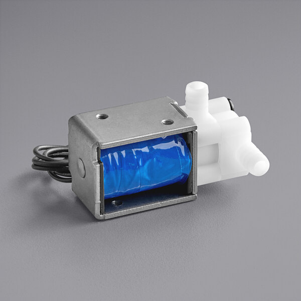 A small blue solenoid valve inside a metal box with a blue bag.