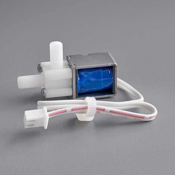 A Galaxy Solenoid Valve for a vacuum packaging machine with white wires.