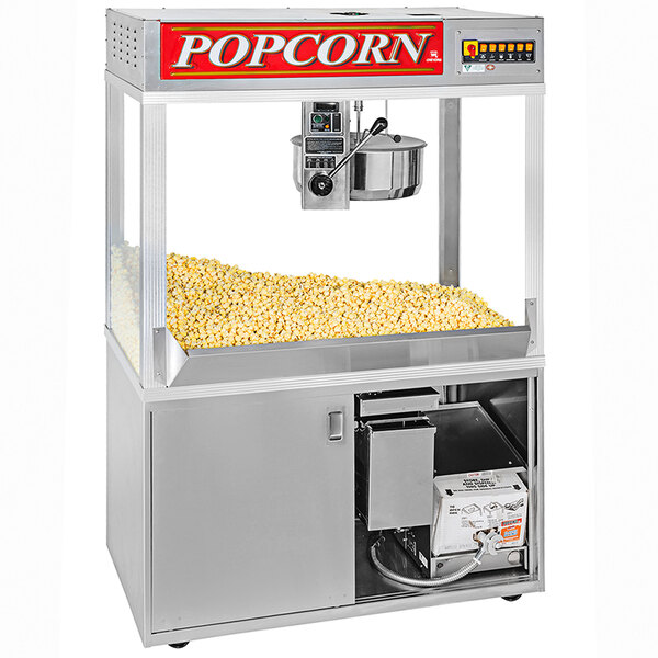 A Cretors popcorn machine with a large bowl of popcorn inside.