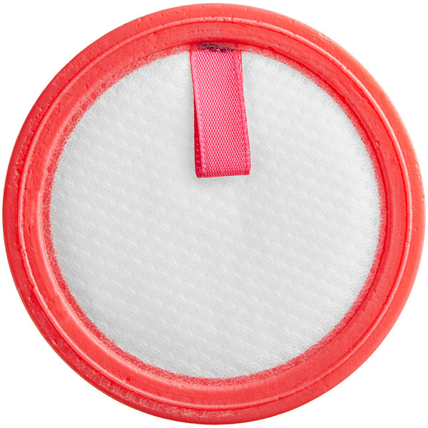A round white sponge filter with a red circle and a pink ribbon.