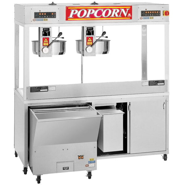 A Cretors floor model popcorn machine with two kettles and a tray.