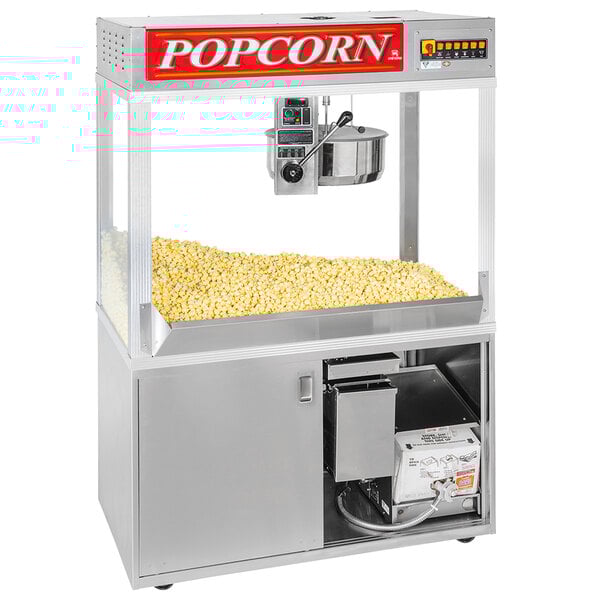 A Cretors floor model popcorn machine with a large bowl of popcorn inside.
