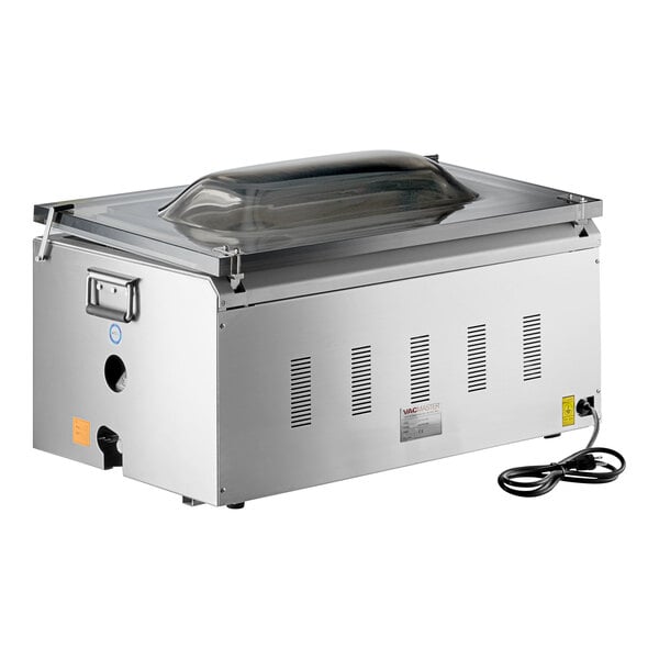 A stainless steel chamber vacuum packaging machine with a clear domed lid and three seal bars.