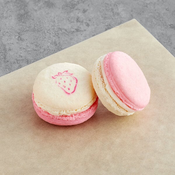 two cookies with a strawberry design on them