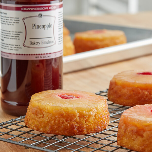 A close-up of a pineapple cake on a cooling rack.