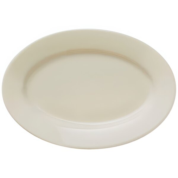 A Libbey Porcelana cream white oval platter with a wide rim.