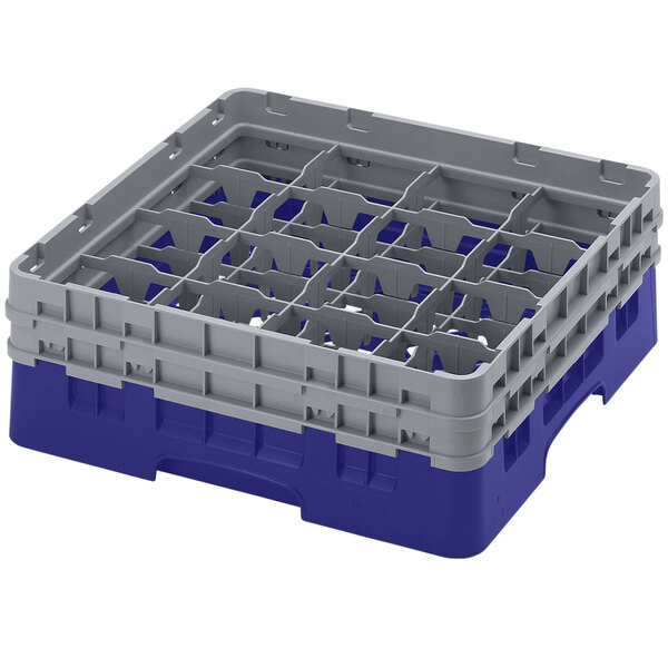 A navy blue plastic Cambro glass rack with 16 compartments and 2 extenders.