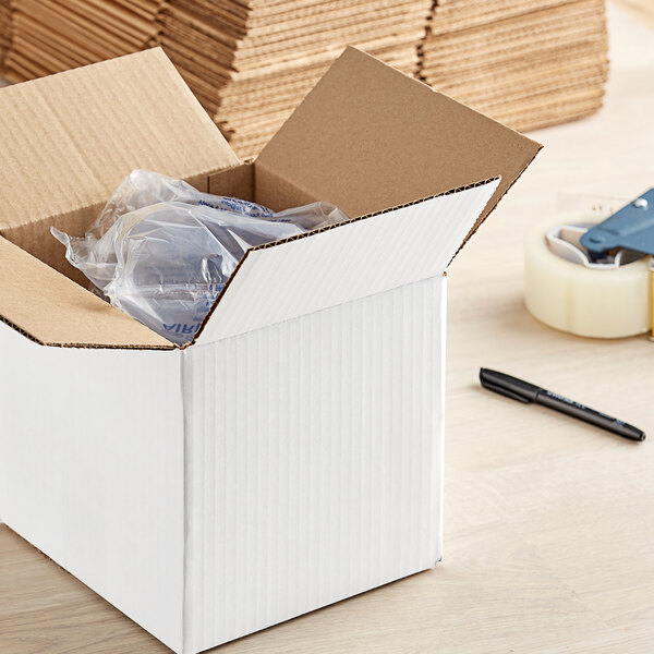 A white Lavex cardboard shipping box with a plastic bag inside.