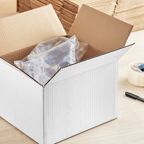 A white Lavex cardboard shipping box with a plastic bag inside.