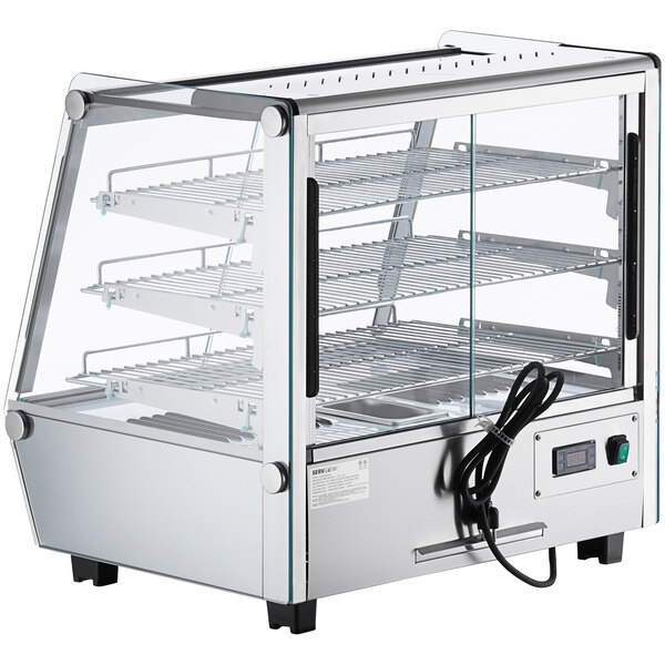 A ServIt countertop heated display case with glass sliding doors and shelves.