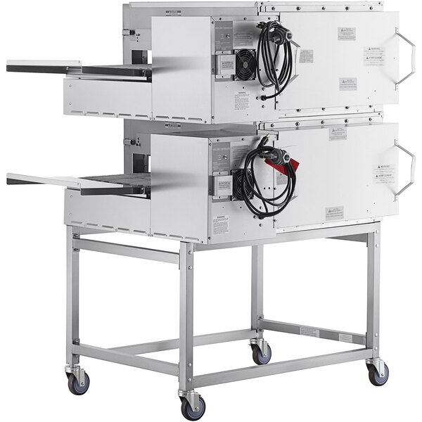 A Lincoln Impinger II double conveyor oven package with two ovens on a metal rack.