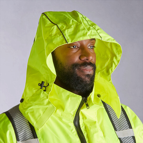 A man wearing a Cordova hi-vis yellow jacket with a hood and zipper.