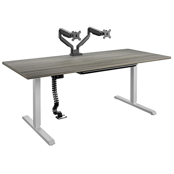 A Bridgeport Pro-Desk with a cable spine, tray, and dual monitor arm.