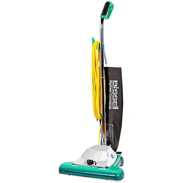 A Bissell Commercial green and yellow upright vacuum cleaner with a green handle.