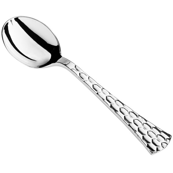 a silver spoon on a white background