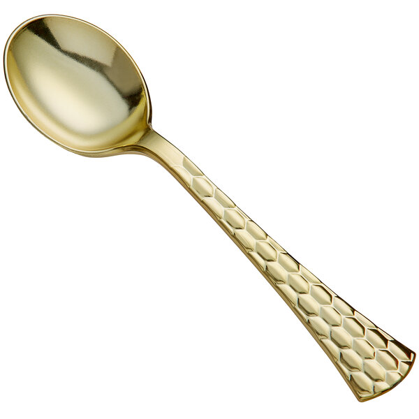 A Visions heavy weight gold plastic soup spoon with a honeycomb design on the handle.