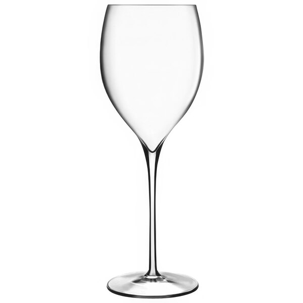 A close-up of a Luigi Bormioli Magnifico clear wine glass with a long stem.