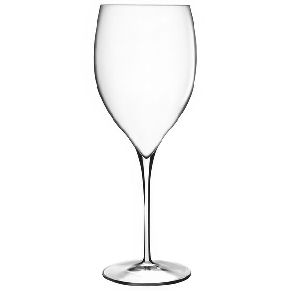 A close-up of a Luigi Bormioli Magnifico clear wine glass with a long stem.