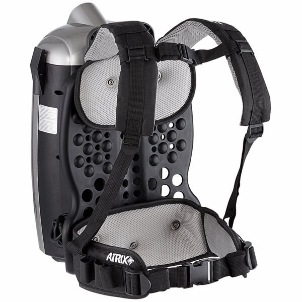 An Atrix backpack vacuum with a harness attached.