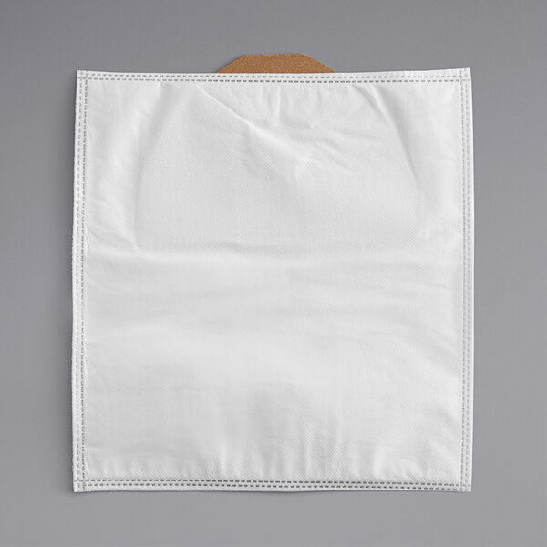 A white cloth bag with a brown handle.
